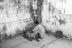 Frankilina Epiayu, a Wayuu indigenous midwife, kneads the belly of a pregnant girl in an informal settlement of Venezuelan migrants in Uribia, in La Guajira, Colombia, on July 5, 2019. In 2019, the photographer moved to La Guajira for six months and followed Epiayu while assisting women with childbirth. People give birth in hospitals. Still, there is no prenatal care for migrant mothers. People often don't know how to get aid, and fearing a confrontation with the authorities, they prefer not to take the chance. Those on the move walk until they are physically unable to. Those in the camps look for transportation to the city hospital or stay at home. 
Epiayu has attended sick children, men, and women with remedies she prepared with the desert's plants. According to the indigenous cosmogony, indigenous people in Colombia are given a place of origin corresponding to where they bury the placenta. By planting it on the earth, midwives ensure the exodus's children a spiritual right to identity, even though they won't be granted legal status if the parents entered Colombia illegally.